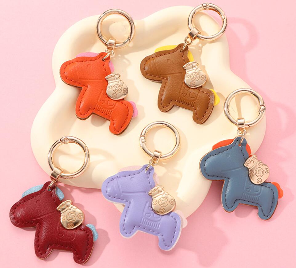 Horses and money bag keychain