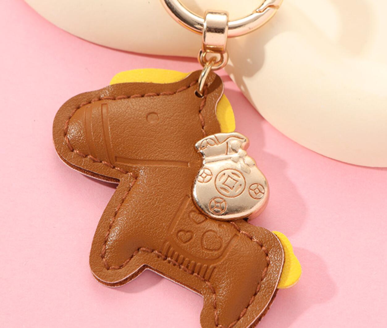 Horses and money bag keychain